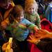 Mary (center), Kara (right) and Paula (top) Rexer receive a close encounter with a crawfish during Earth Day on Sunday, April 21. AnnArbor.com I Daniel Brenner